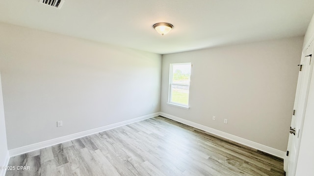 1209 Seafoam St, Panama City, FL 32404 - empty room featuring wood finished floors and baseboards