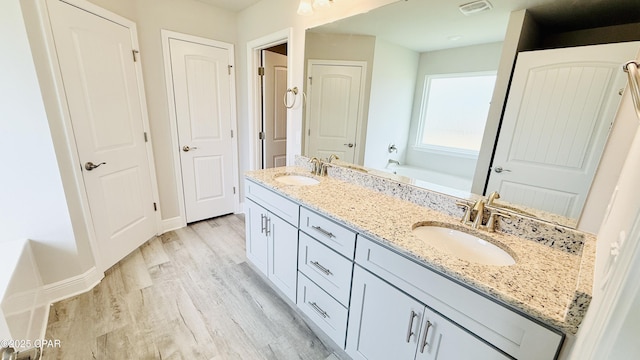 1209 Seafoam St, Panama City, FL 32404 - empty room featuring arched walkways, ceiling fan, vaulted ceiling, light wood-style flooring, and baseboards