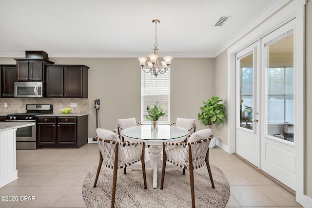 117 Cedar Hammock Ln, Panama City Beach, FL 32407 - dining area with light tile patterned floors, a chandelier, ornamental molding, and baseboards