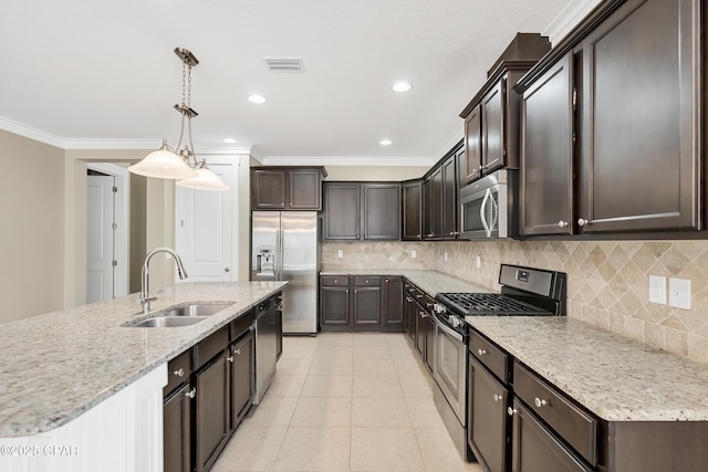 117 Cedar Hammock Ln, Panama City Beach, FL 32407 - kitchen with appliances with stainless steel finishes, a sink, dark brown cabinetry, crown molding, and tasteful backsplash