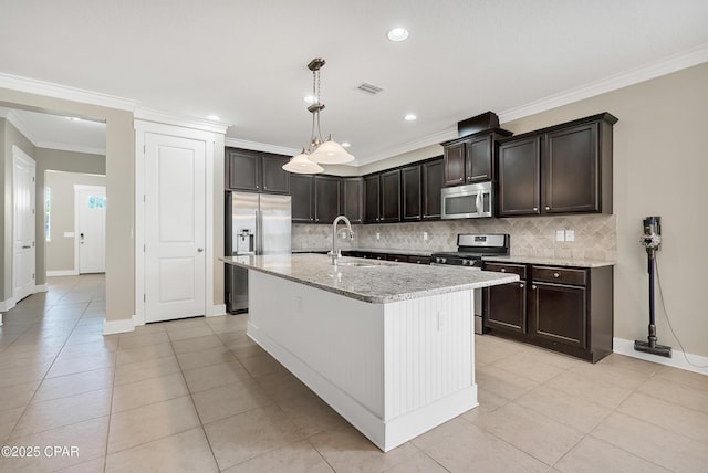 117 Cedar Hammock Ln, Panama City Beach, FL 32407 - kitchen with stainless steel appliances, a sink, decorative backsplash, light tile patterned floors, and dark brown cabinetry