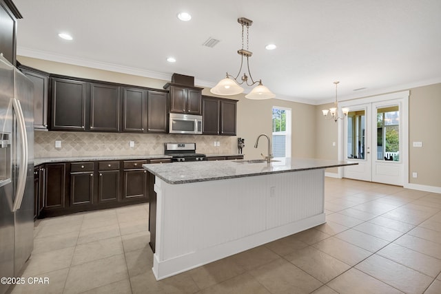 117 Cedar Hammock Ln, Panama City Beach, FL 32407 - kitchen featuring stainless steel appliances, a sink, tasteful backsplash, light stone countertops, and ornamental molding