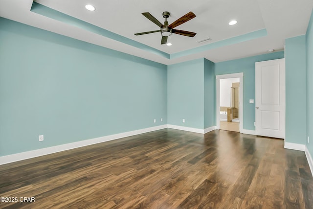 117 Cedar Hammock Ln, Panama City Beach, FL 32407 - unfurnished room with a raised ceiling, baseboards, ceiling fan, recessed lighting, and dark wood-style floors