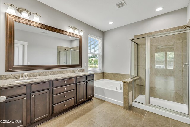 117 Cedar Hammock Ln, Panama City Beach, FL 32407 - full bath featuring a garden tub, double vanity, a stall shower, tile patterned floors, and recessed lighting