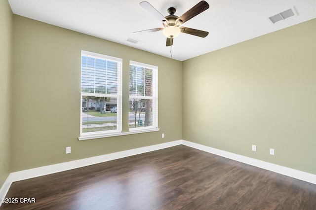117 Cedar Hammock Ln, Panama City Beach, FL 32407 - empty room featuring dark wood finished floors, a ceiling fan, and baseboards