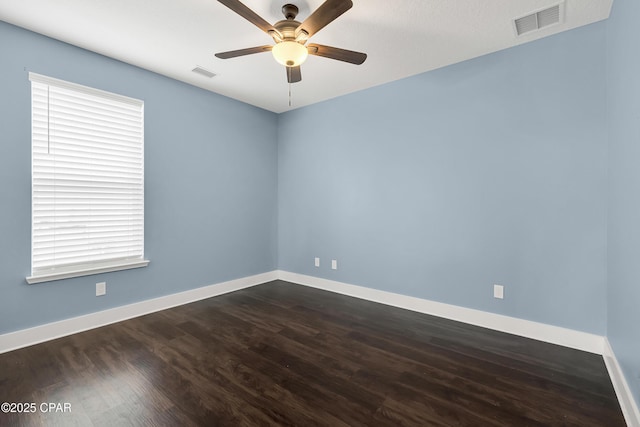 117 Cedar Hammock Ln, Panama City Beach, FL 32407 - unfurnished room with dark wood finished floors, ceiling fan, and baseboards