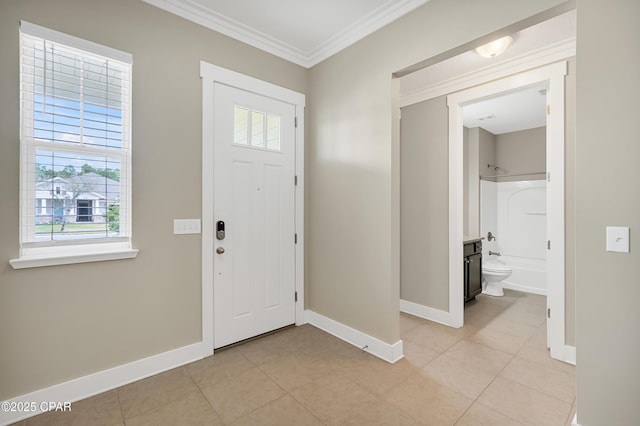 117 Cedar Hammock Ln, Panama City Beach, FL 32407 - entryway with baseboards, healthy amount of natural light, ornamental molding, and light tile patterned floors