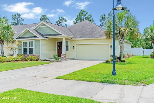 117 Cedar Hammock Ln, Panama City Beach, FL 32407 - craftsman-style home with an attached garage, concrete driveway, and stone siding