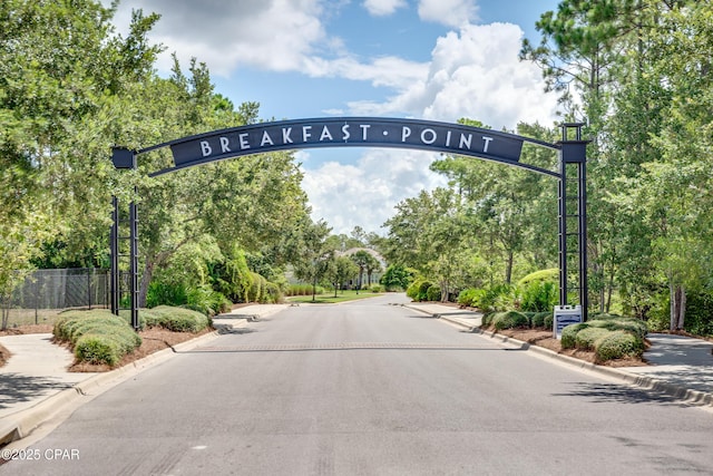 117 Cedar Hammock Ln, Panama City Beach, FL 32407 - view of road featuring curbs and view of wooded area
