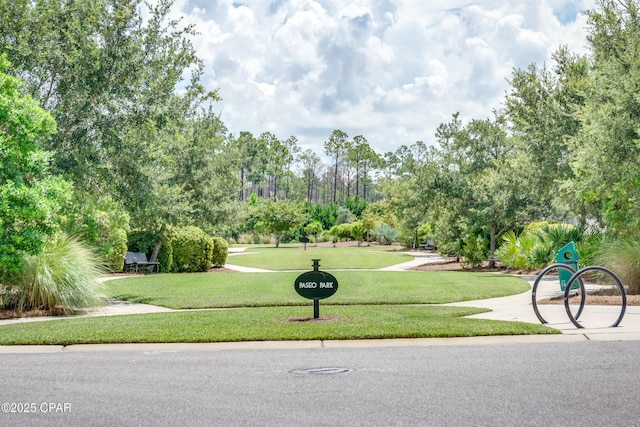 117 Cedar Hammock Ln, Panama City Beach, FL 32407 - view of community featuring a lawn and view of scattered trees