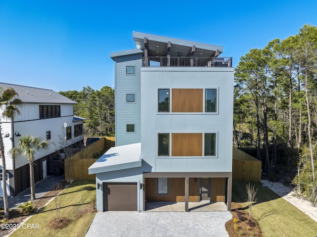 17 Woodland Dr, Santa Rosa Beach, FL 32459 - view of front of property featuring a balcony and decorative driveway