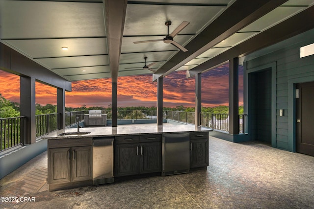 17 Woodland Dr, Santa Rosa Beach, FL 32459 - patio terrace at dusk with ceiling fan, a sink, and an outdoor kitchen