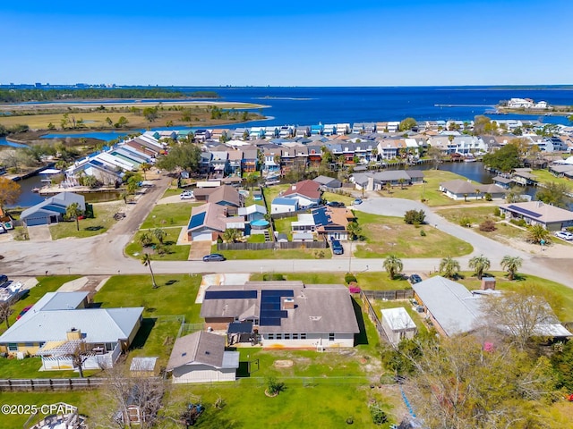 birds eye view of property featuring a residential view and a water view