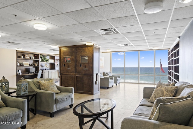 16819 Front Beach Rd Unit 2903, Panama City Beach, FL 32413 - living room featuring a water view, a wall of windows, a drop ceiling, and visible vents