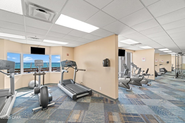 16819 Front Beach Rd Unit 2903, Panama City Beach, FL 32413 - exercise room featuring a paneled ceiling, carpet floors, baseboards, and visible vents