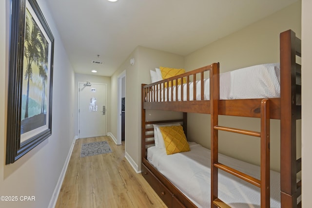 17739 Front Beach Rd Unit 1204W, Panama City Beach, FL 32413 - unfurnished bedroom with light wood-style floors, multiple windows, and recessed lighting