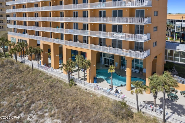 view of apartment building / complex featuring a community pool