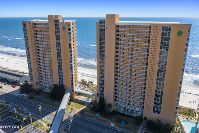 view of property featuring view of water and beach