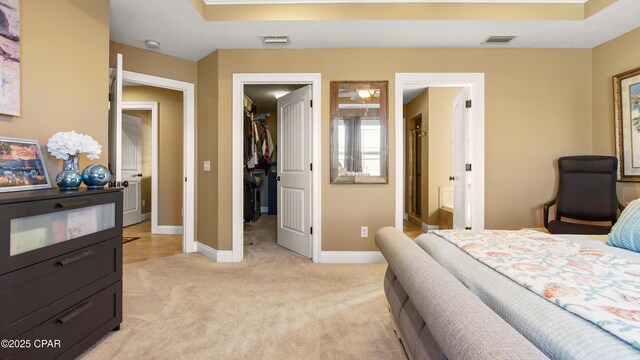 4439 Bylsma Cir, Panama City, FL 32404 - bedroom with a walk in closet, light carpet, baseboards, and a closet