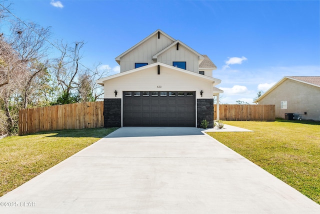 420 Lacosta Ave, Panama City, FL 32404 - view of front of property featuring concrete driveway, fence, stone siding, board and batten siding, and a garage