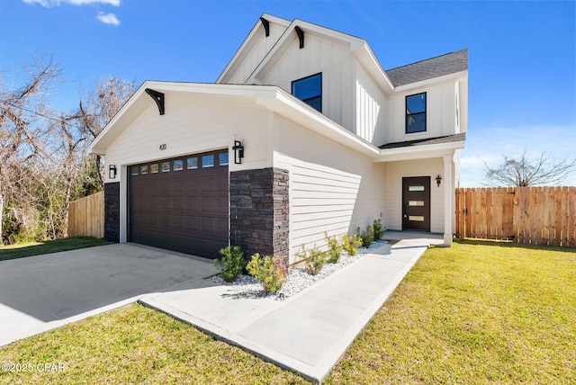 420 Lacosta Ave, Panama City, FL 32404 - modern farmhouse style home with stone siding, an attached garage, fence, board and batten siding, and a front lawn
