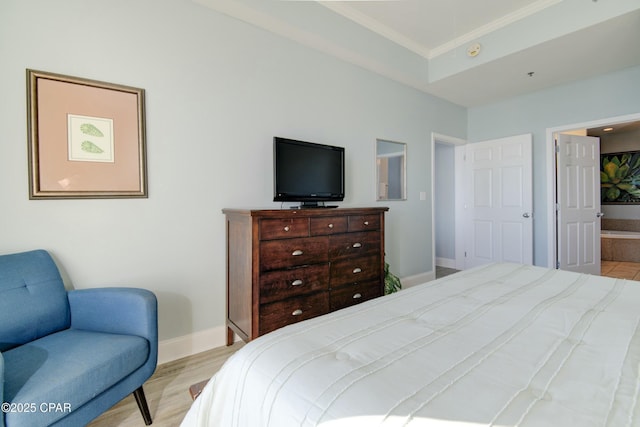 9860 S Thomas Dr Unit 2111, Panama City Beach, FL 32408 - bedroom with crown molding, baseboards, and wood finished floors