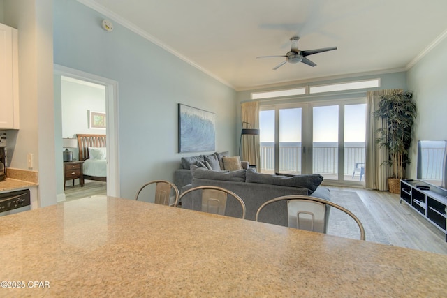 9860 S Thomas Dr Unit 2111, Panama City Beach, FL 32408 - dining space featuring a ceiling fan, ornamental molding, and light wood-type flooring