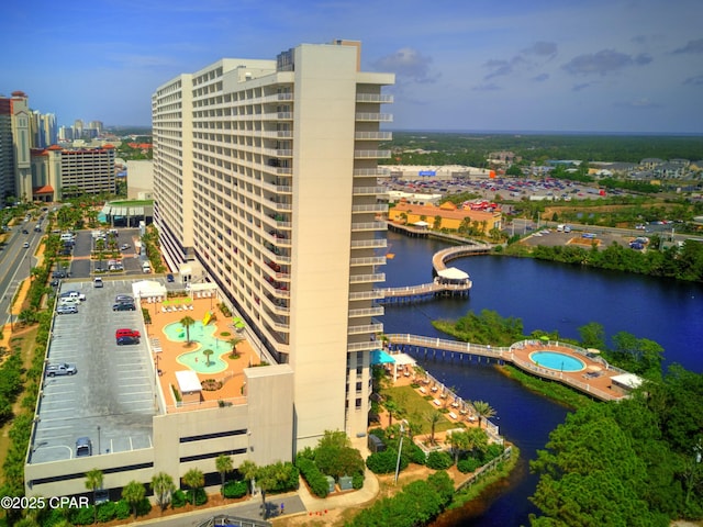 9860 S Thomas Dr Unit 2111, Panama City Beach, FL 32408 - view of urban area featuring a nearby body of water, a pool area, and a notable bridge