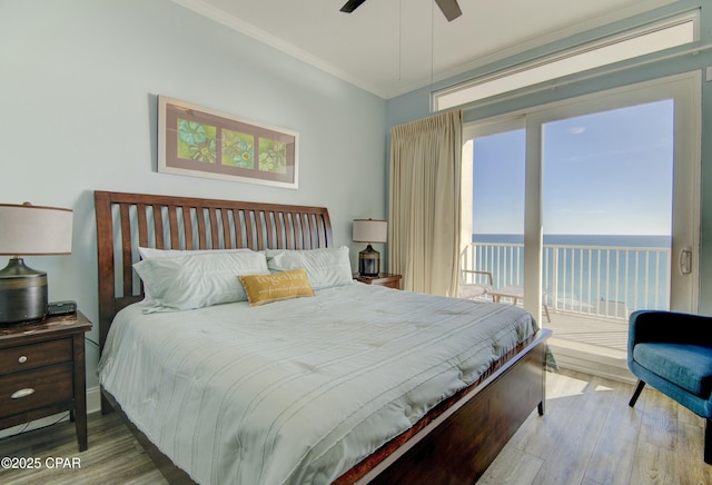 9860 S Thomas Dr Unit 2111, Panama City Beach, FL 32408 - bedroom featuring wood finished floors, a water view, access to outside, ceiling fan, and crown molding