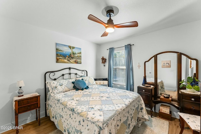 1527 Wateroak Dr, Lynn Haven, FL 32444 - bedroom with wood finished floors, a ceiling fan, and baseboards