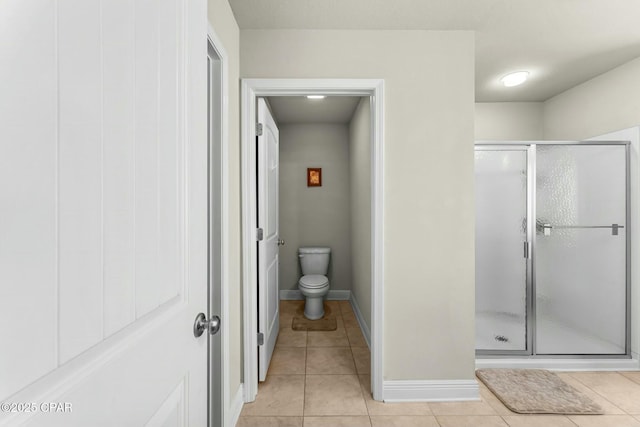 1527 Wateroak Dr, Lynn Haven, FL 32444 - full bath featuring a stall shower, tile patterned floors, toilet, and baseboards