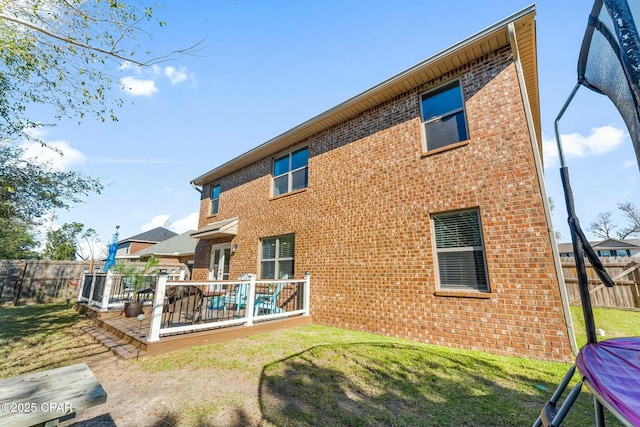 1527 Wateroak Dr, Lynn Haven, FL 32444 - rear view of house with brick siding and a deck