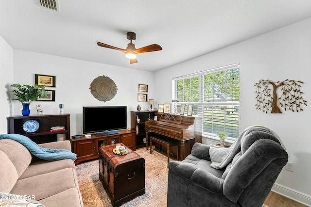 1527 Wateroak Dr, Lynn Haven, FL 32444 - living room featuring a ceiling fan, baseboards, and light wood finished floors
