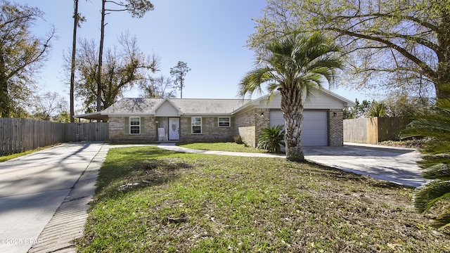 single story home with a garage, concrete driveway, a front yard, and fence
