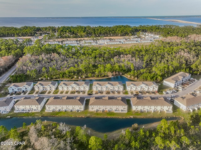 aerial view with a residential view and a water view