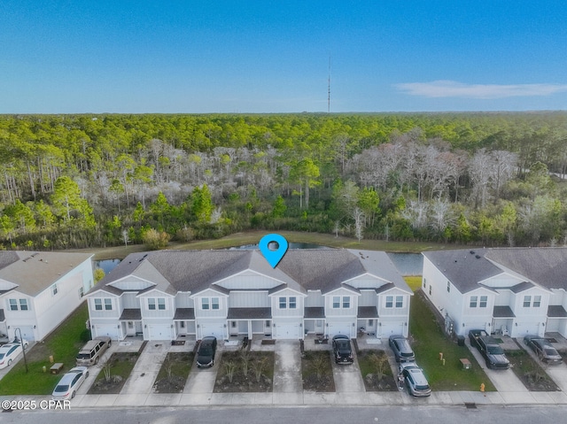 bird's eye view featuring a residential view and a forest view