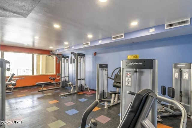 exercise room with recessed lighting and visible vents