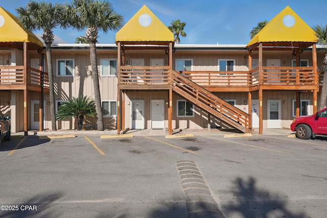 5505 Sun Harbor Rd Unit 143, Panama City, FL 32401 - view of building exterior with uncovered parking and stairway