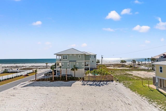 2501 Highway 98 C C, Mexico Beach, FL 32456 - view of front of house with view of water and beach, metal roof, and fence