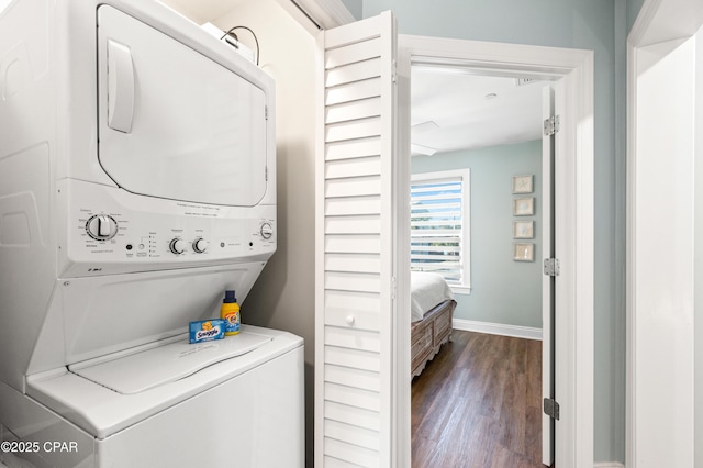 2501 Highway 98 C C, Mexico Beach, FL 32456 - laundry room with stacked washer / drying machine, dark wood-style floors, and baseboards