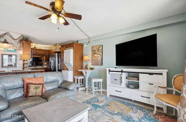 8743 Thomas Dr Unit 225, Panama City Beach, FL 32408 - living area with baseboards, a ceiling fan, and light tile patterned floors