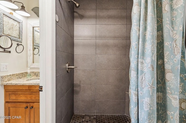 8743 Thomas Dr Unit 225, Panama City Beach, FL 32408 - bathroom with vanity and tiled shower
