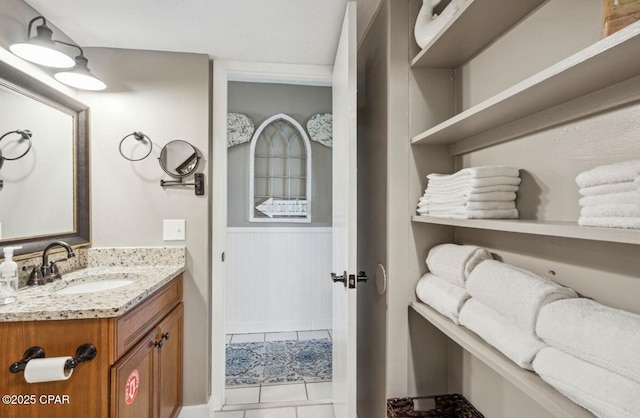 8743 Thomas Dr Unit 225, Panama City Beach, FL 32408 - bathroom featuring tile patterned floors and vanity