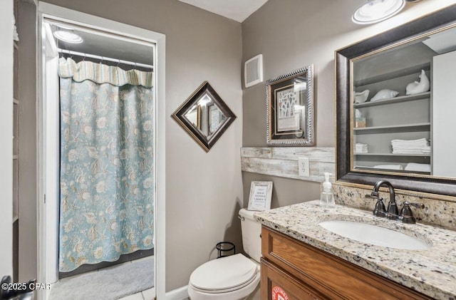8743 Thomas Dr Unit 225, Panama City Beach, FL 32408 - full bathroom featuring visible vents, vanity, a shower with shower curtain, and toilet
