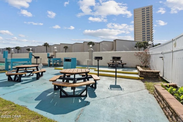 8743 Thomas Dr Unit 225, Panama City Beach, FL 32408 - view of patio / terrace with a fenced backyard