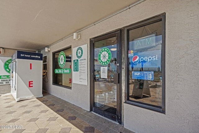 8743 Thomas Dr Unit 225, Panama City Beach, FL 32408 - entrance to property with stucco siding