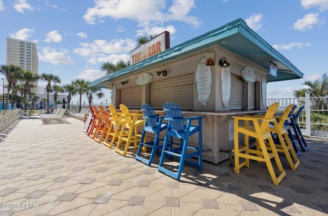 8743 Thomas Dr Unit 225, Panama City Beach, FL 32408 - exterior space featuring fence and outdoor dry bar