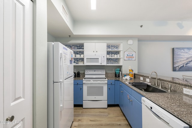 9900 S Thomas Dr Unit 425, Panama City, FL 32408 - kitchen featuring a sink, open shelves, light wood-style flooring, white appliances, and blue cabinetry