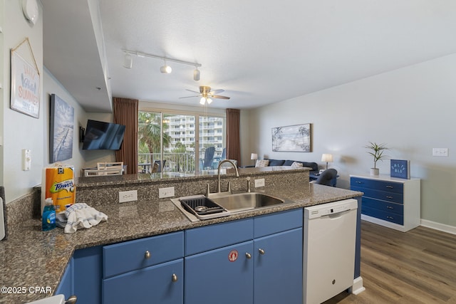 9900 S Thomas Dr Unit 425, Panama City, FL 32408 - kitchen with blue cabinetry, dark wood finished floors, a sink, open floor plan, and white dishwasher