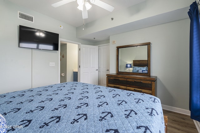 9900 S Thomas Dr Unit 425, Panama City, FL 32408 - bedroom with wood finished floors, baseboards, ceiling fan, and visible vents